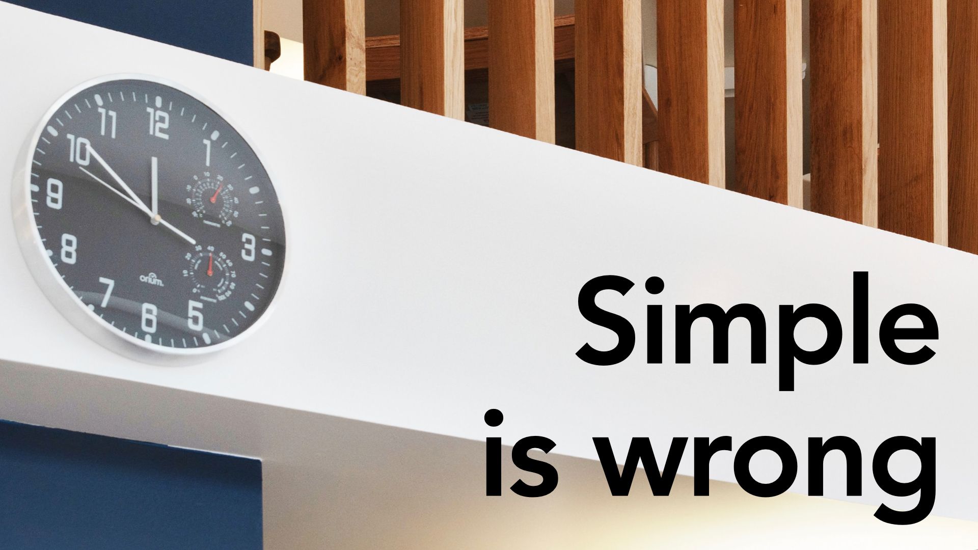 Slide text "Simple is wrong" overlaid on image of modernist wooden decor and clock