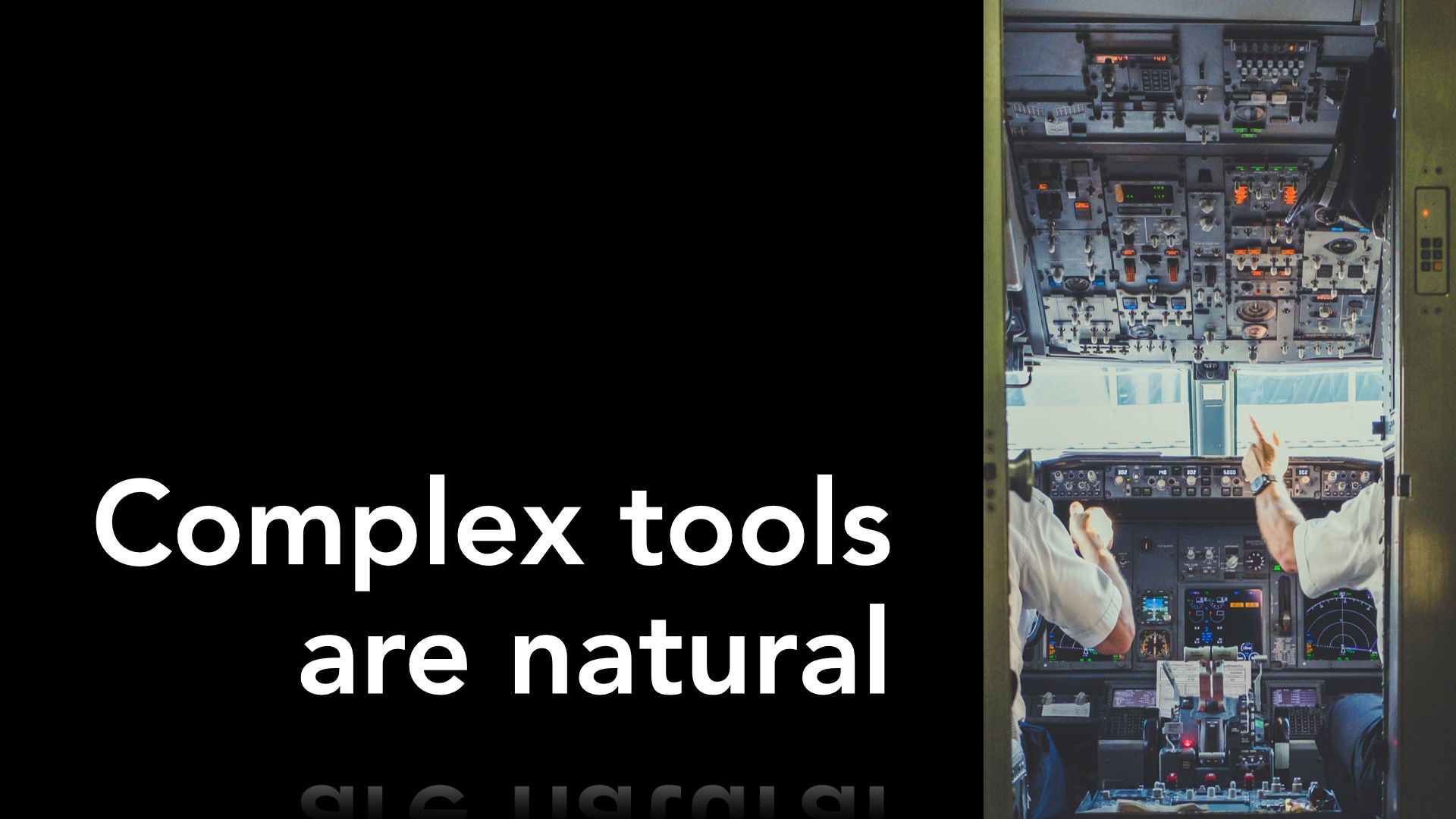 Slide text "Complex tools are natural" on plain background, with image of airplane cockpit to the right, with many controls