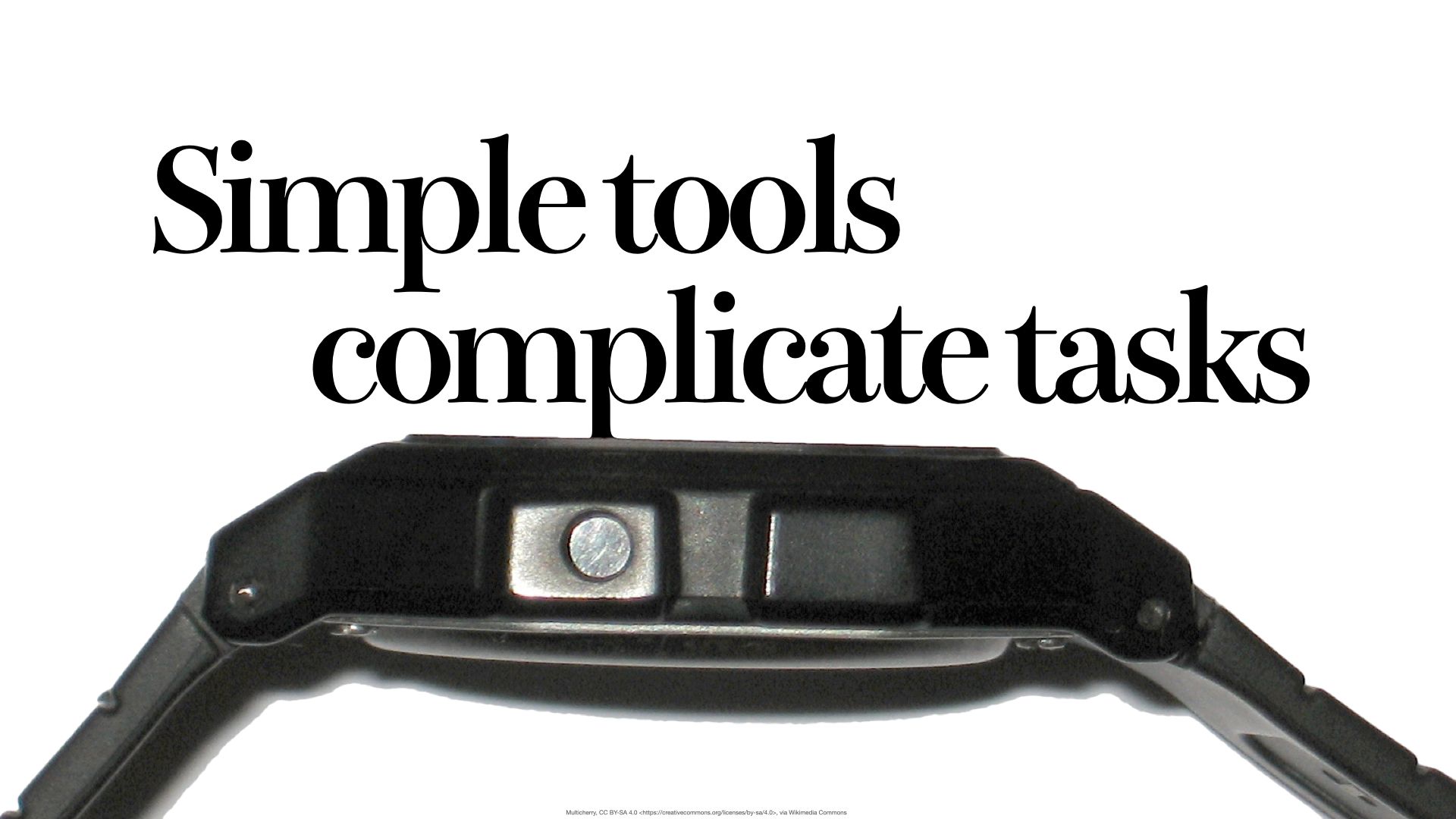 Slide text "Simple tools complicate tasks" above an old digital watch viewed from the side, one control button showing